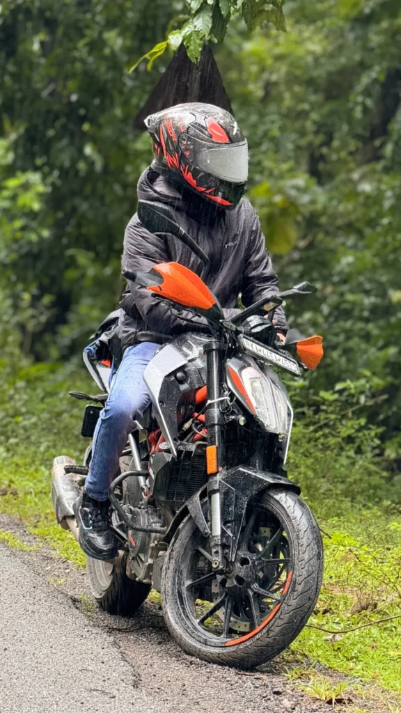 Amar Karthik sitting on his clean looking KTM 250 Duke Motorcycle.