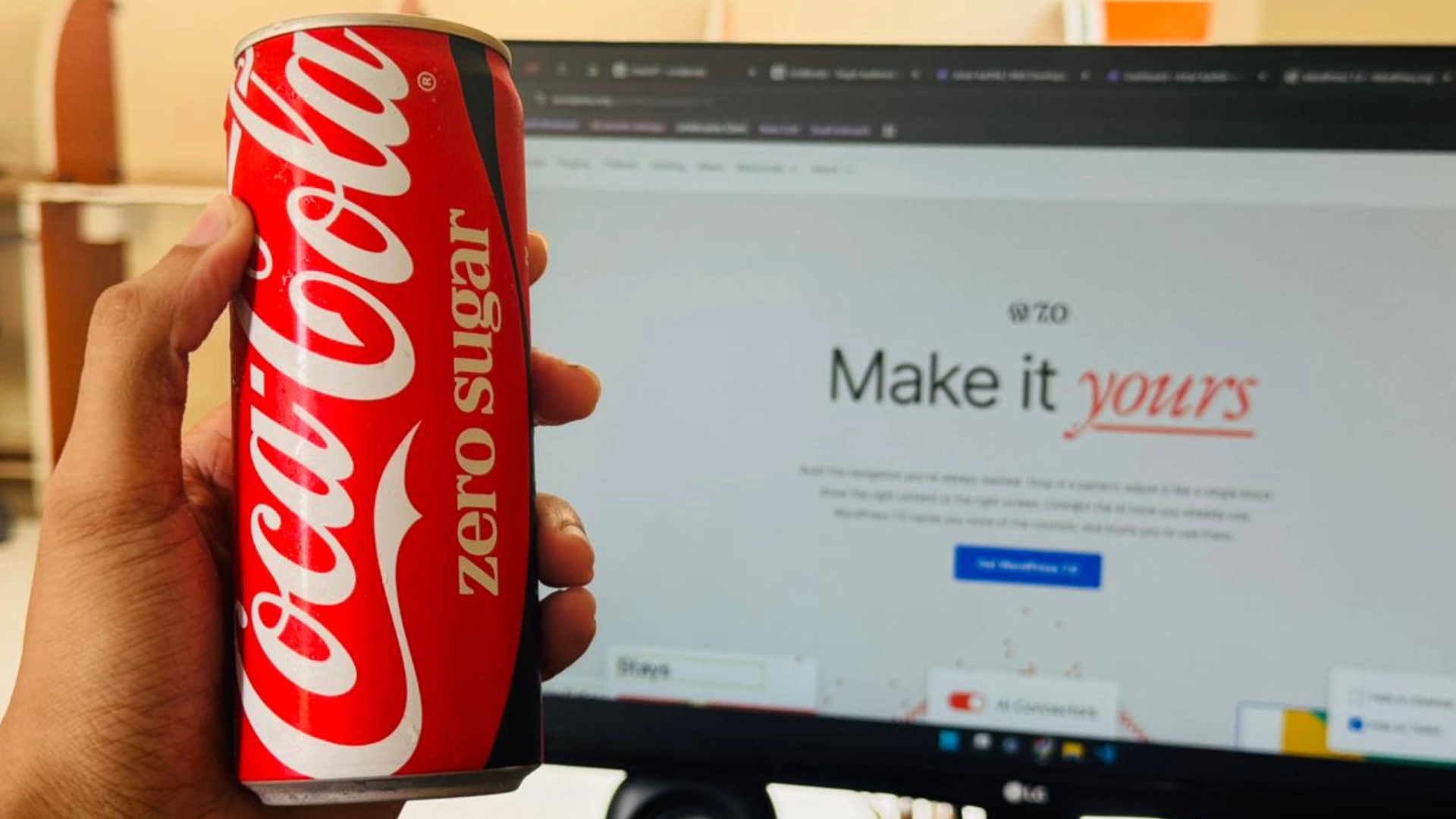 amar karthik holding a coke in hand in front of his PC